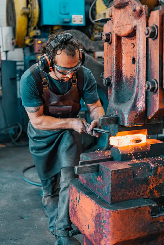 fortis forge workers forging mild steel socket under press